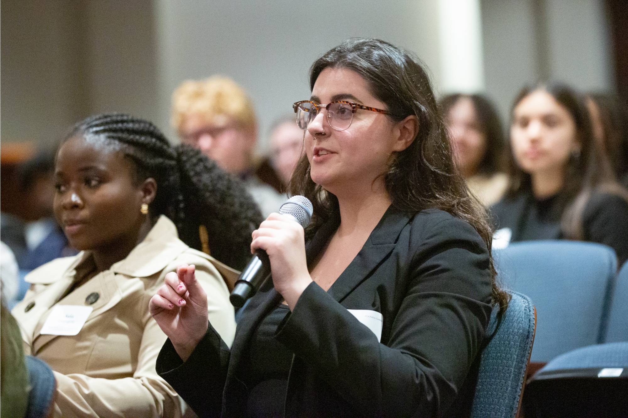 A Cook Leadership Academy fellow asks a question from the audience during a Hauenstein Center event.